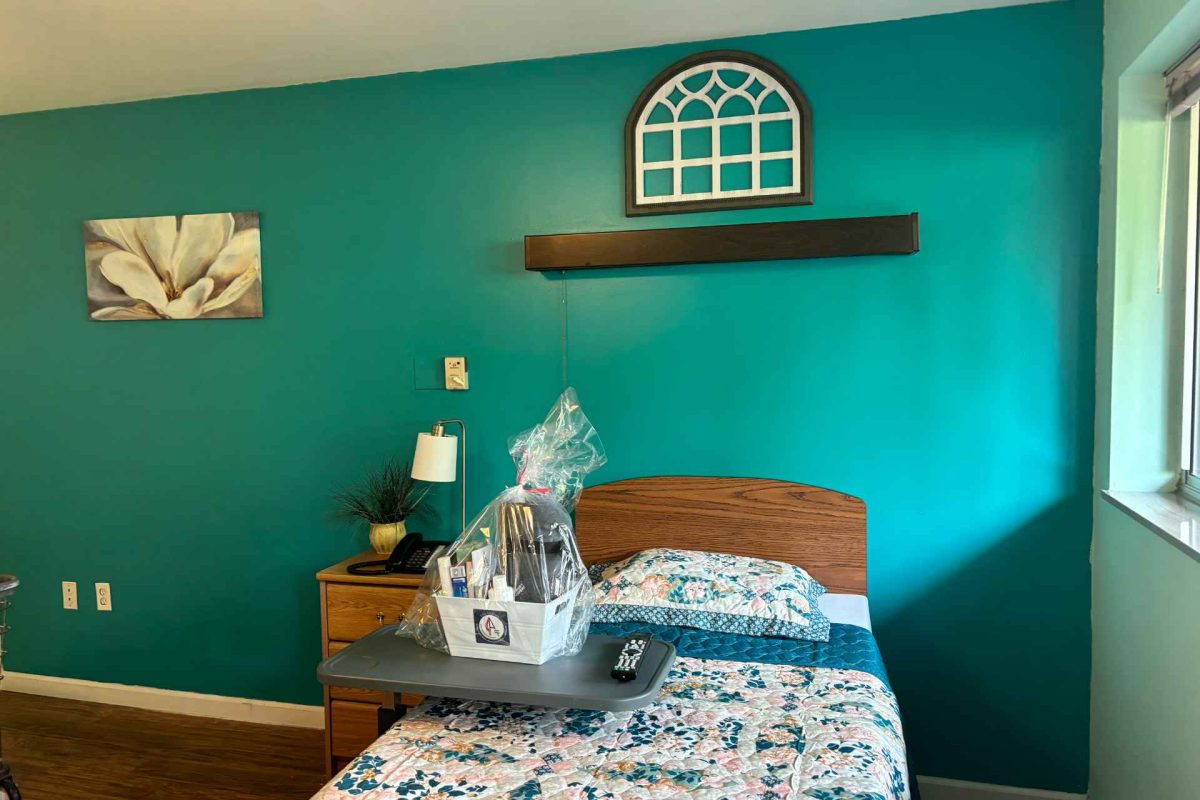 Brightly colored resident room with personal touches.