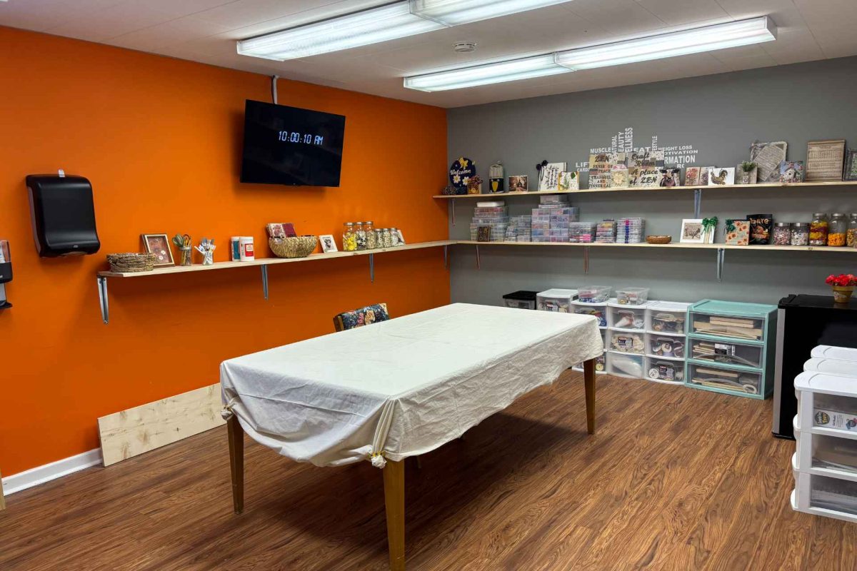 Interior common area with shelves and a table
