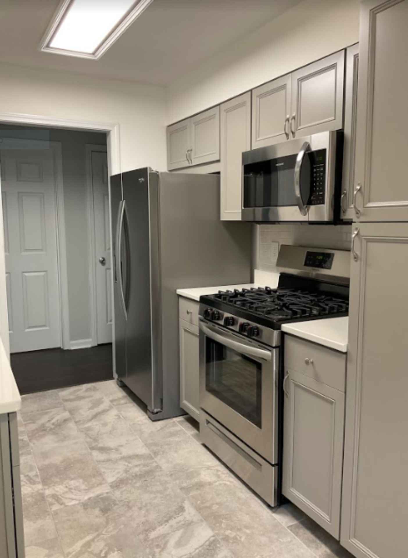 Modern kitchen with appliances and cabinetry.