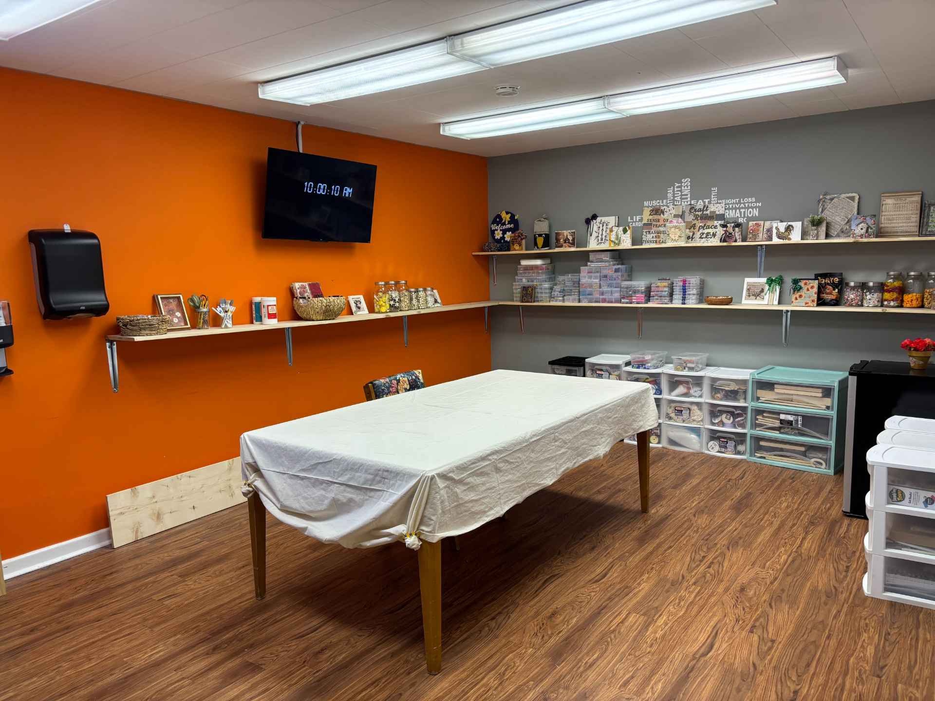 Craft room with a table and organized supplies.