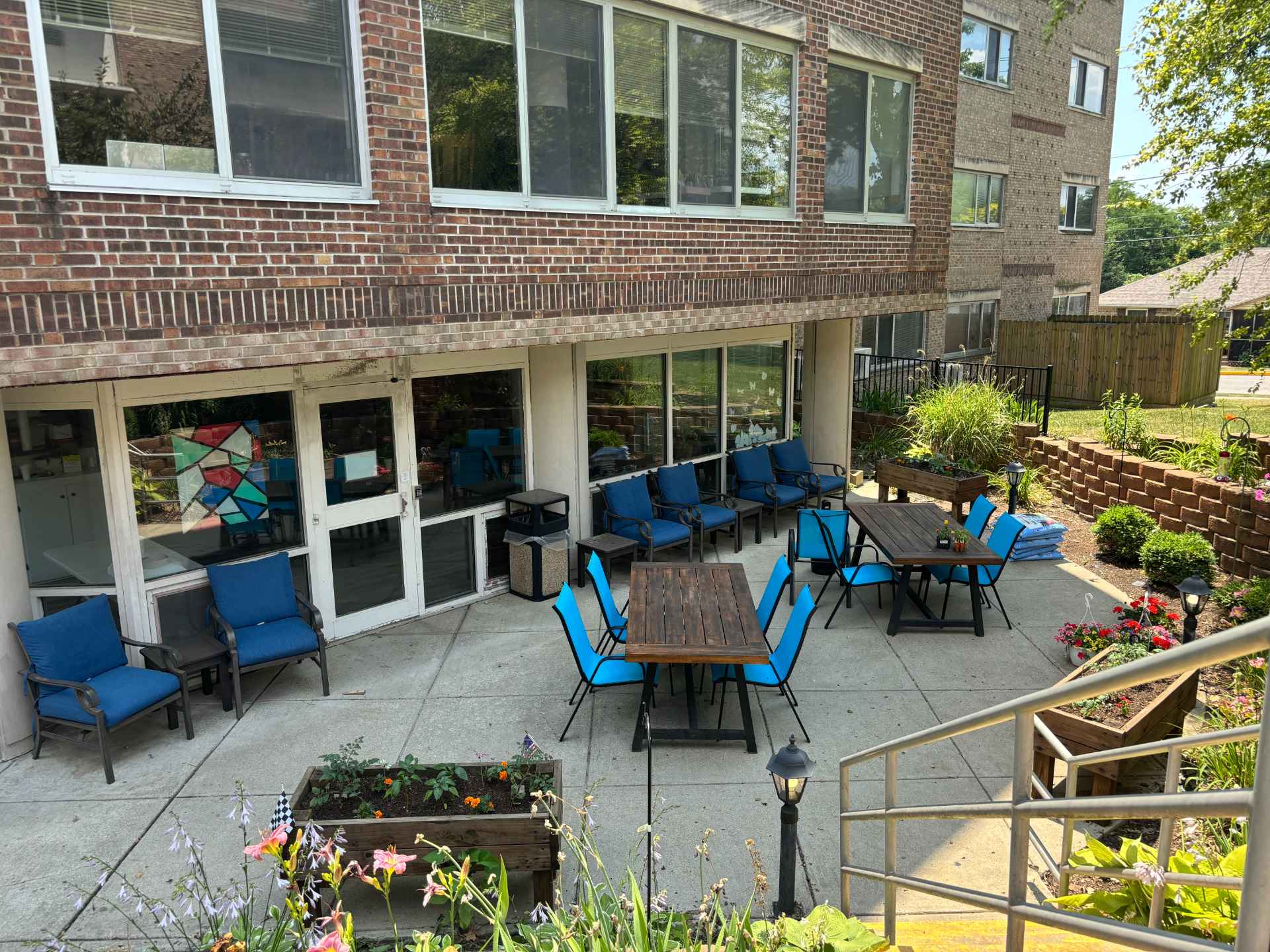Outdoor seating area with tables and chairs.
