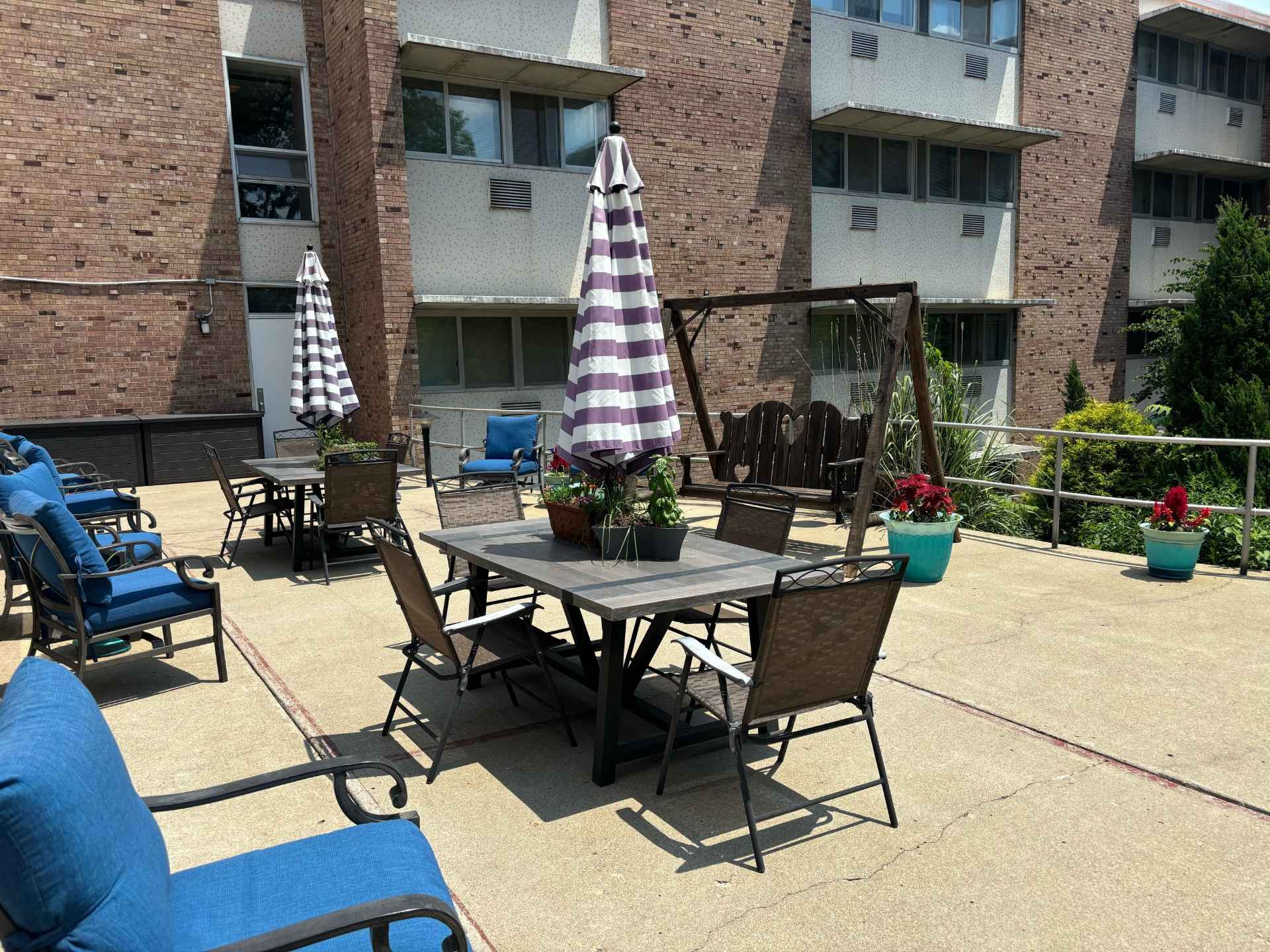 Outdoor seating area with tables and umbrellas