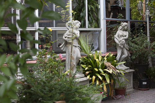 Garden area with decorative statues and plants