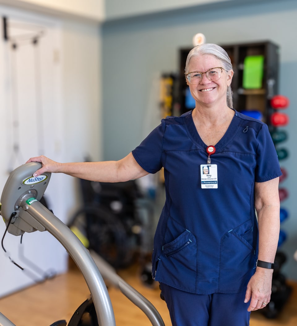 Staff member smiling in an activity room