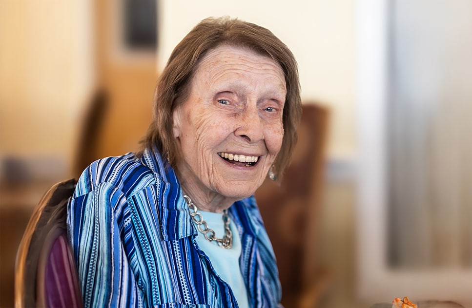 Smiling older woman in a senior living facility