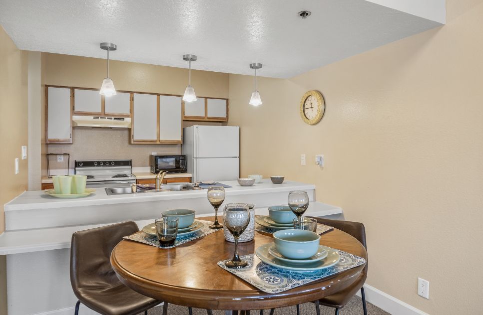 Clean, modern kitchenette setup with dining table