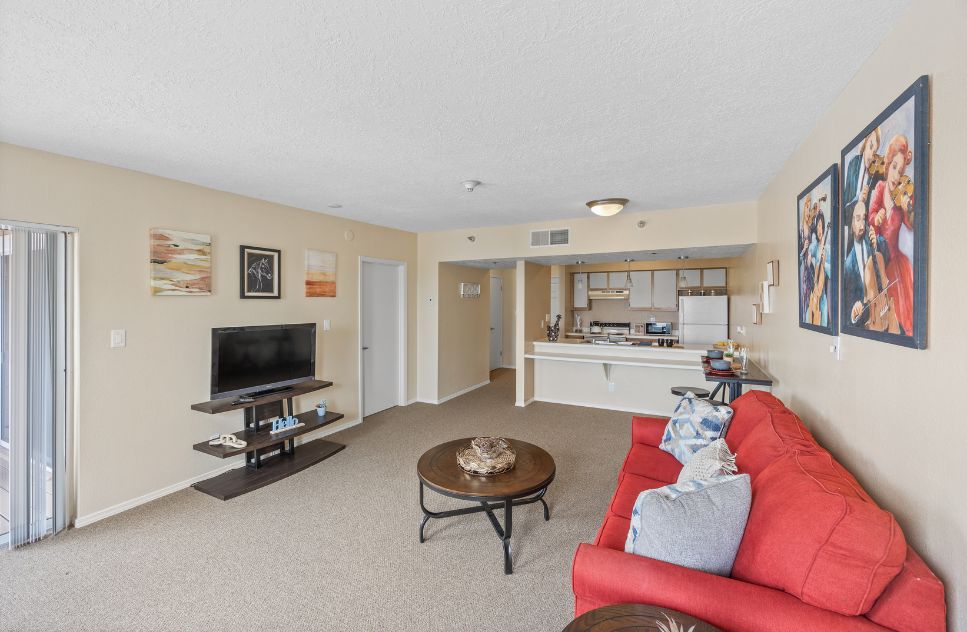 Interior living area with a red couch and TV