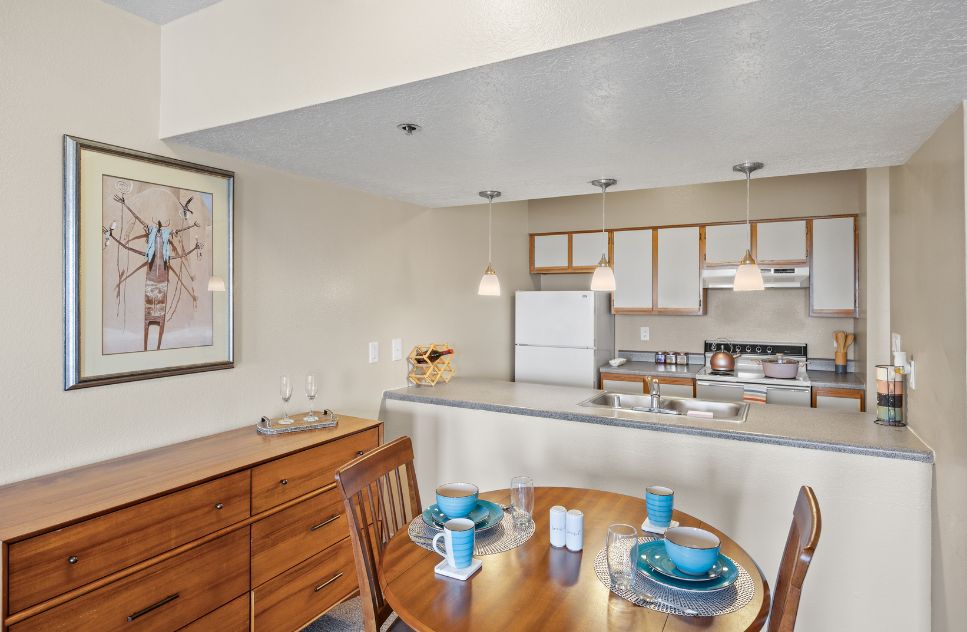 Interior view of a dining area with kitchen
