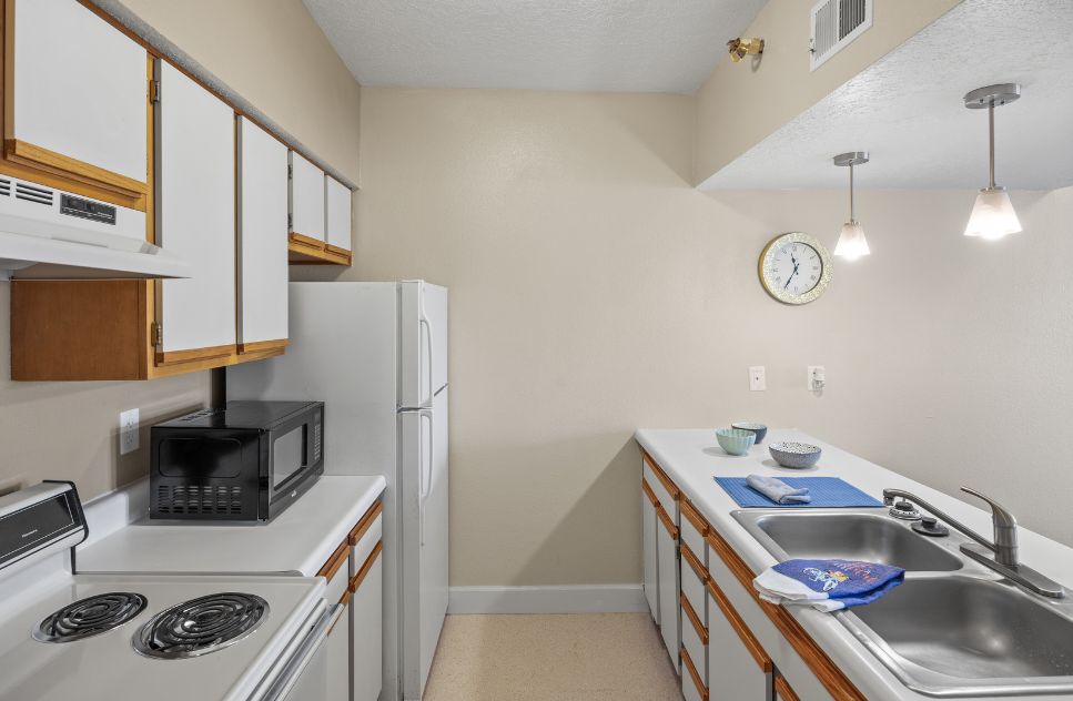 Interior view of a kitchen with appliances and cabinets