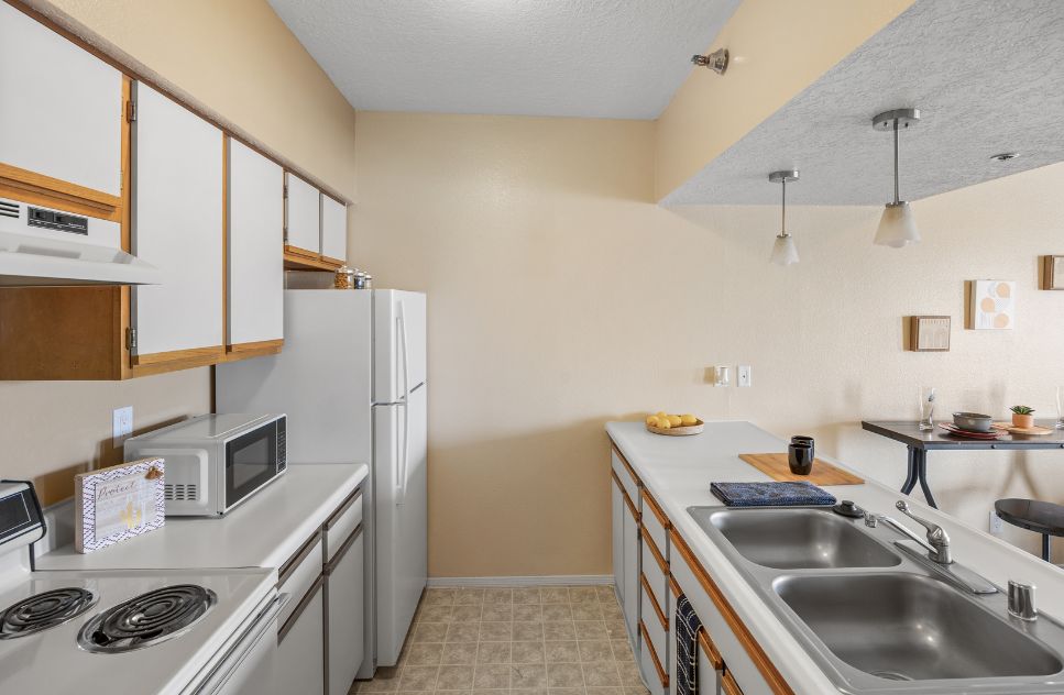 Bright and clean kitchen area with appliances