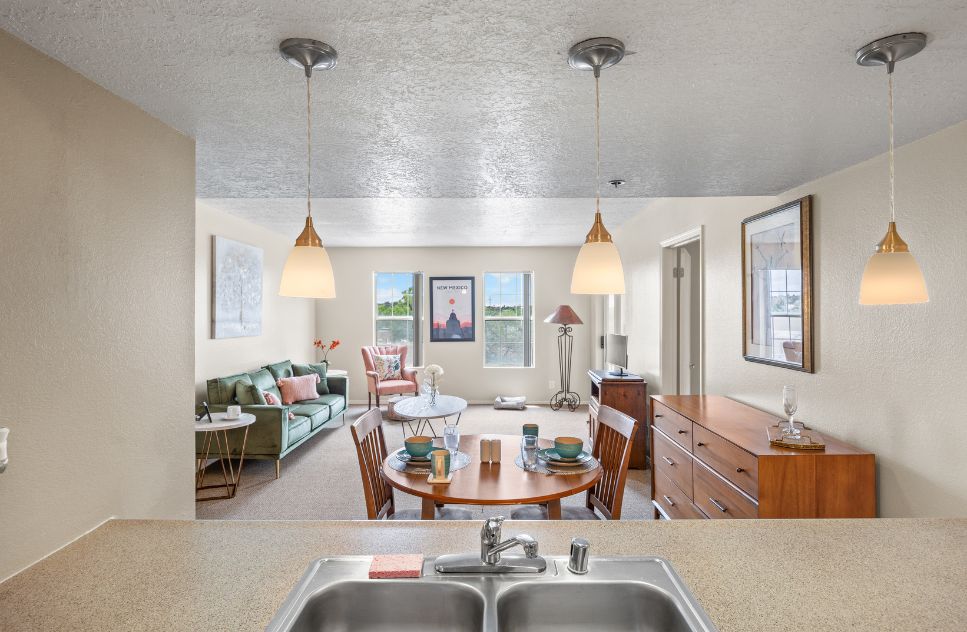 A bright common area with dining and seating space