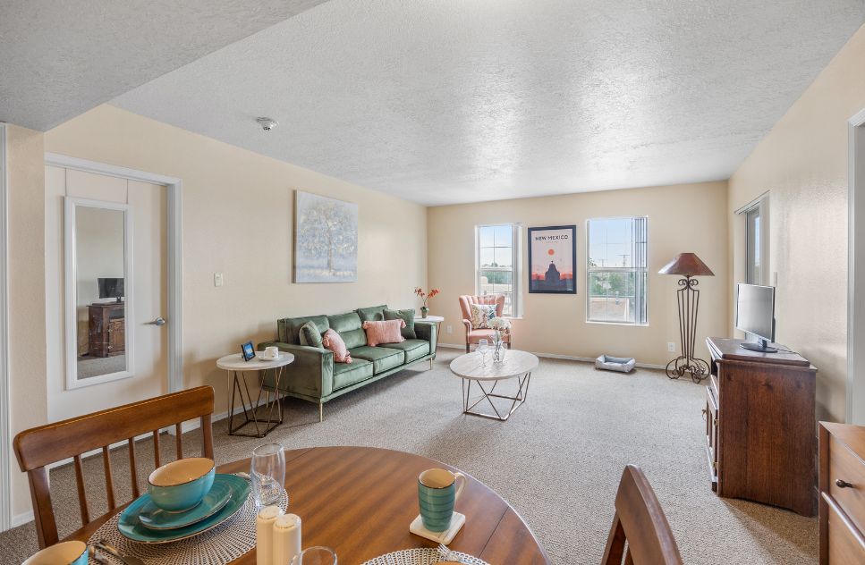 Bright interior of a shared living space with a couch and table