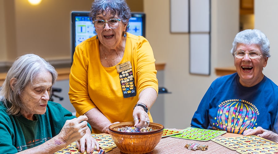 Residents playing bingo in an activity room