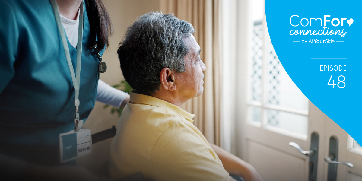 Staff member assisting a senior resident indoors.