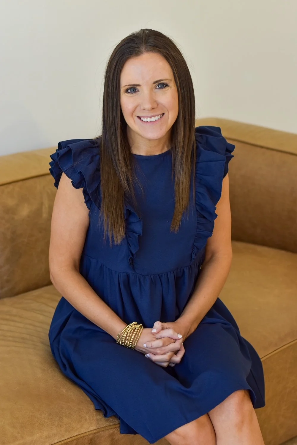 Female staff member smiling in lounge area