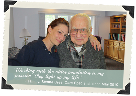 Care specialist with elderly resident in a cozy room