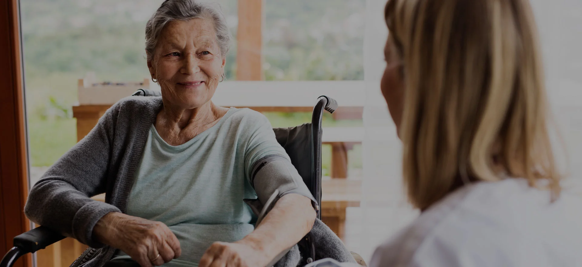 Resident smiling during a conversation with staff.