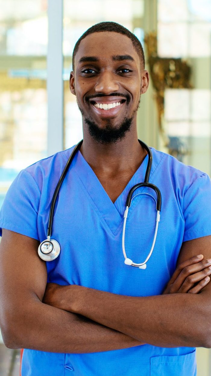 Smiling healthcare professional wearing scrubs