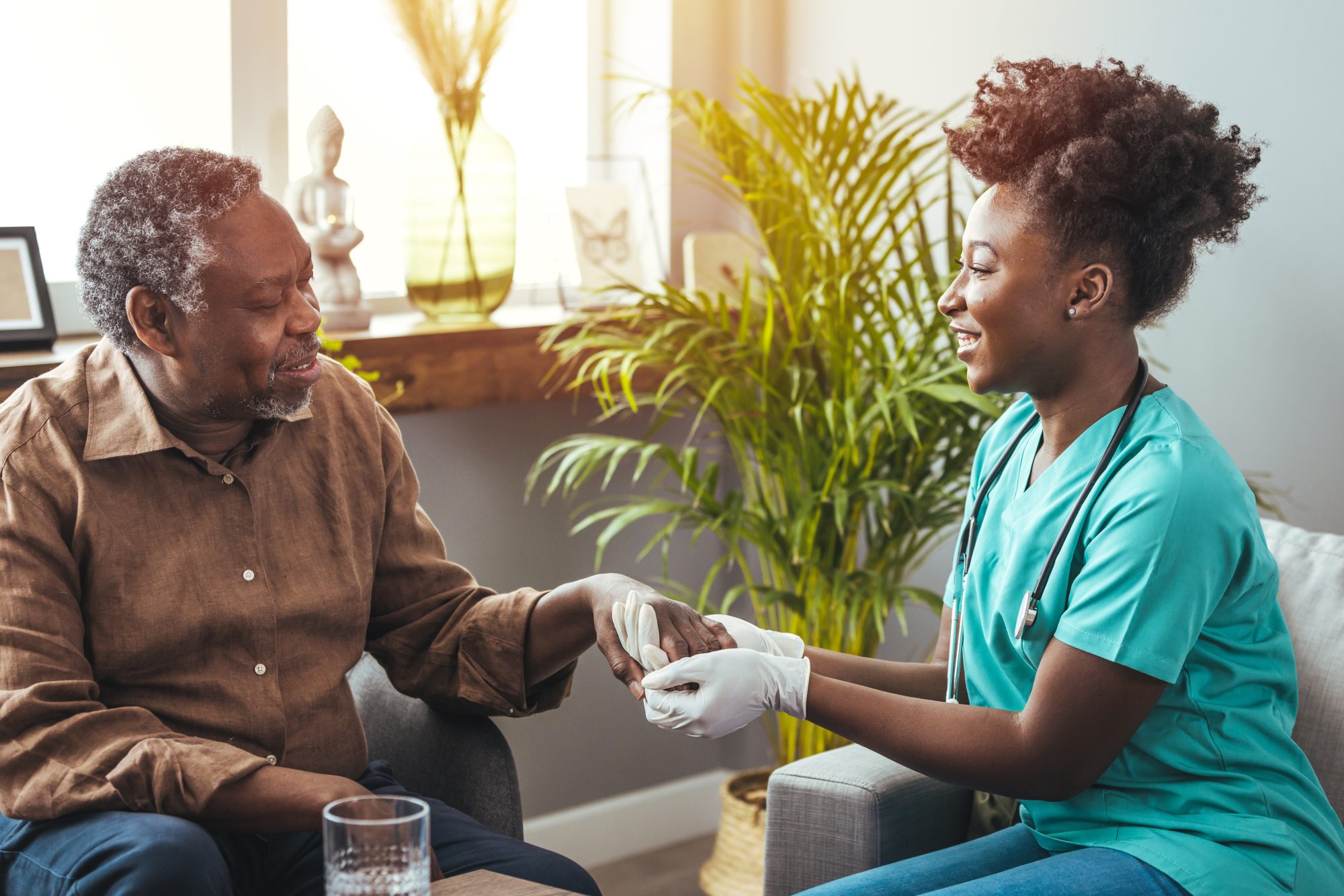 Nurse assisting an elderly man in a cozy interior.