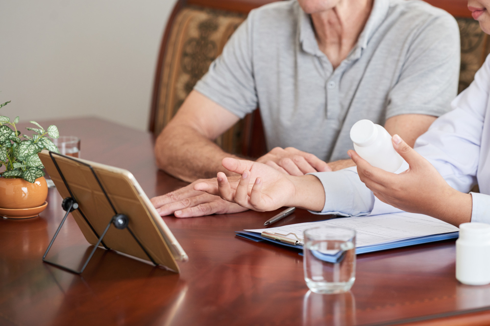 Healthcare professional consulting with senior resident.