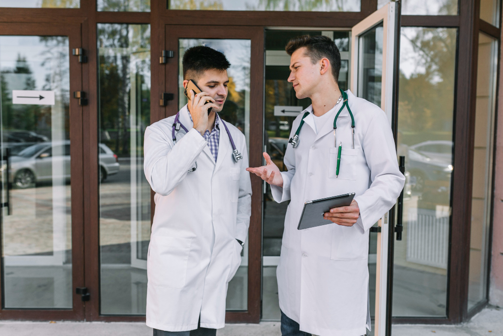 Two doctors discussing outside a facility