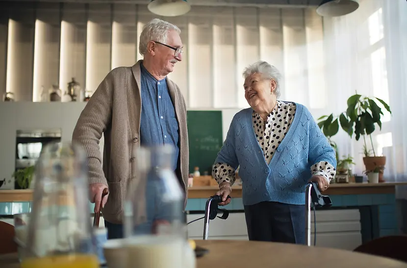 Seniors laughing together in a common area