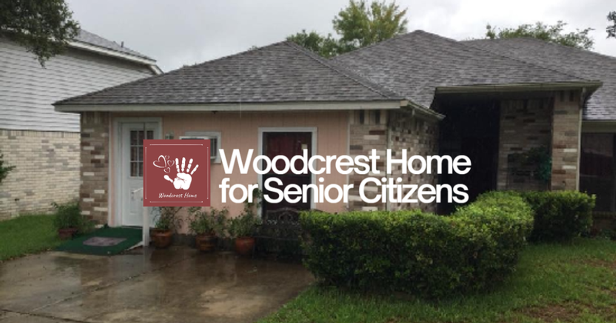 Exterior view of Woodcrest Home with logo