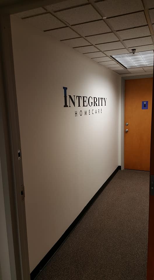 Interior hallway with signage for Integrity Home Care