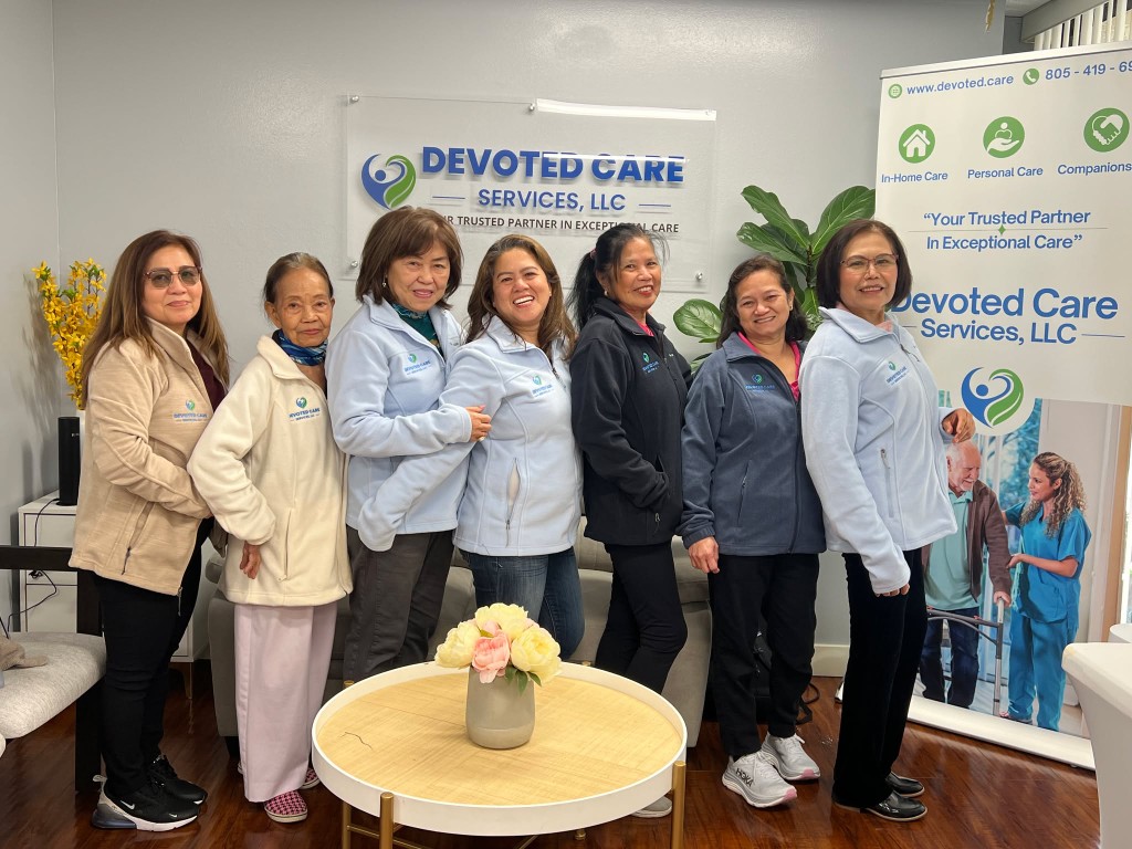 Staff members posing in a common area of the facility