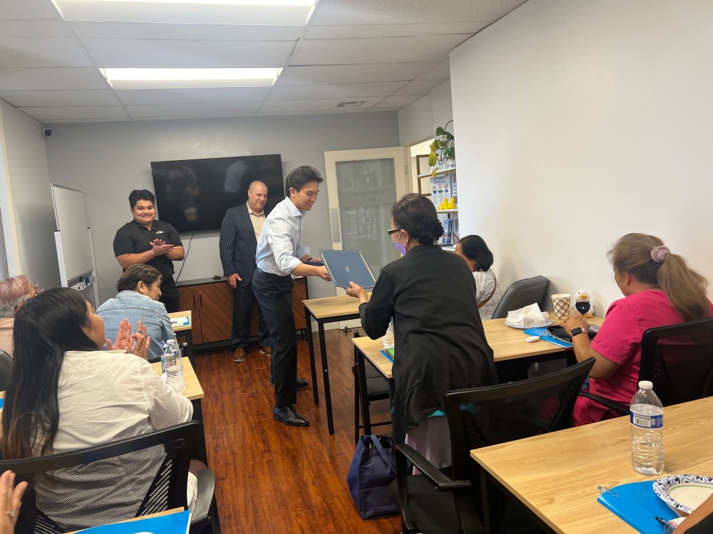 Residents and staff engaged in an indoor activity
