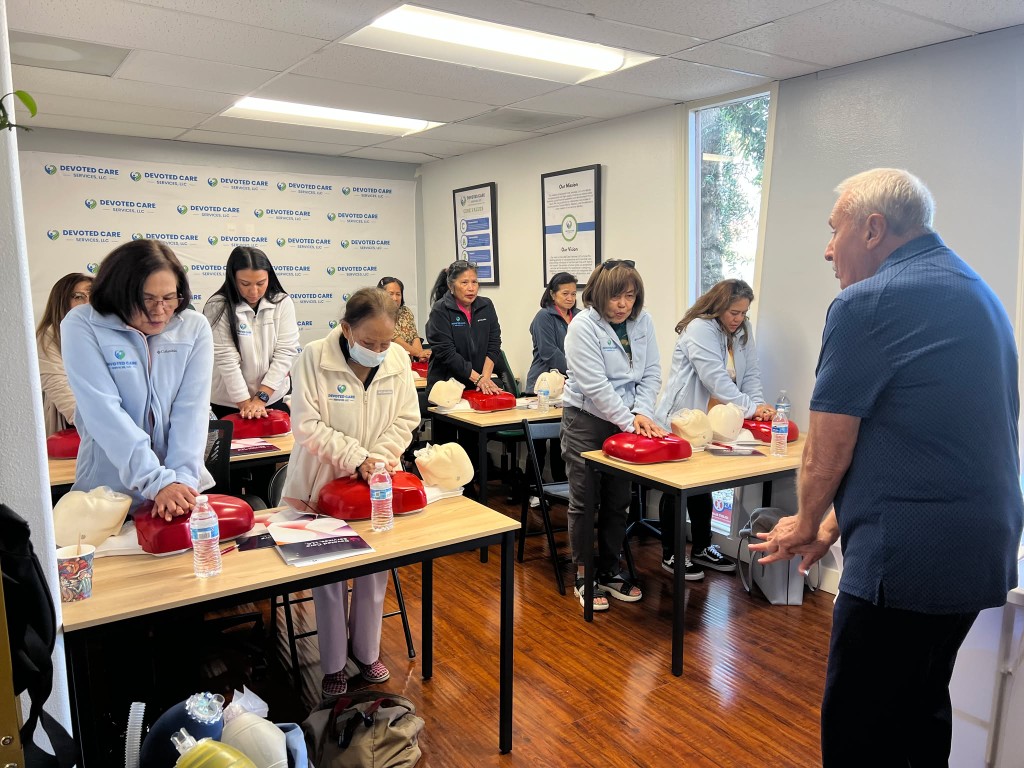 Residents and staff participating in CPR training