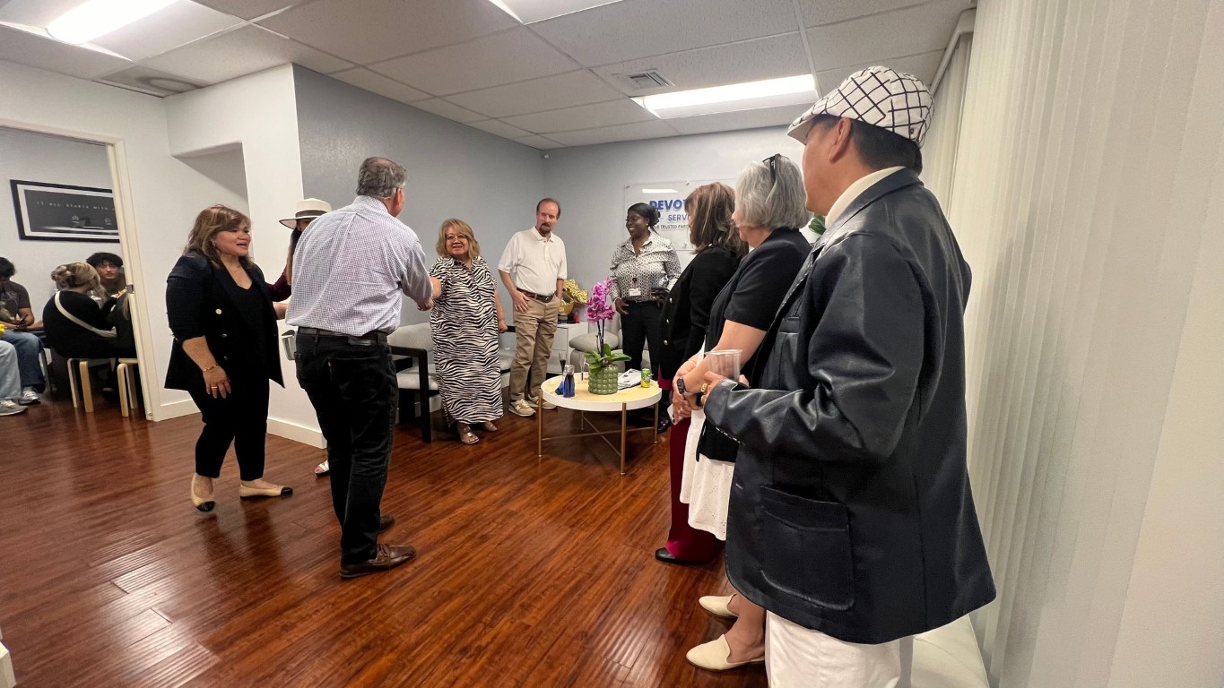 Residents and staff interacting in a welcoming common area