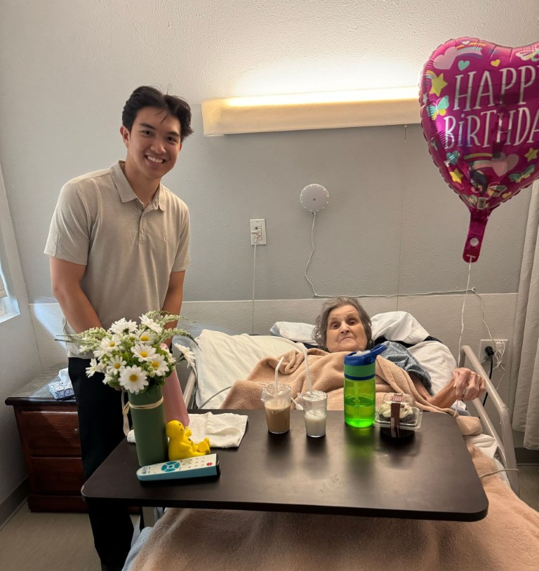 Celebrating a resident's birthday with cake and balloons