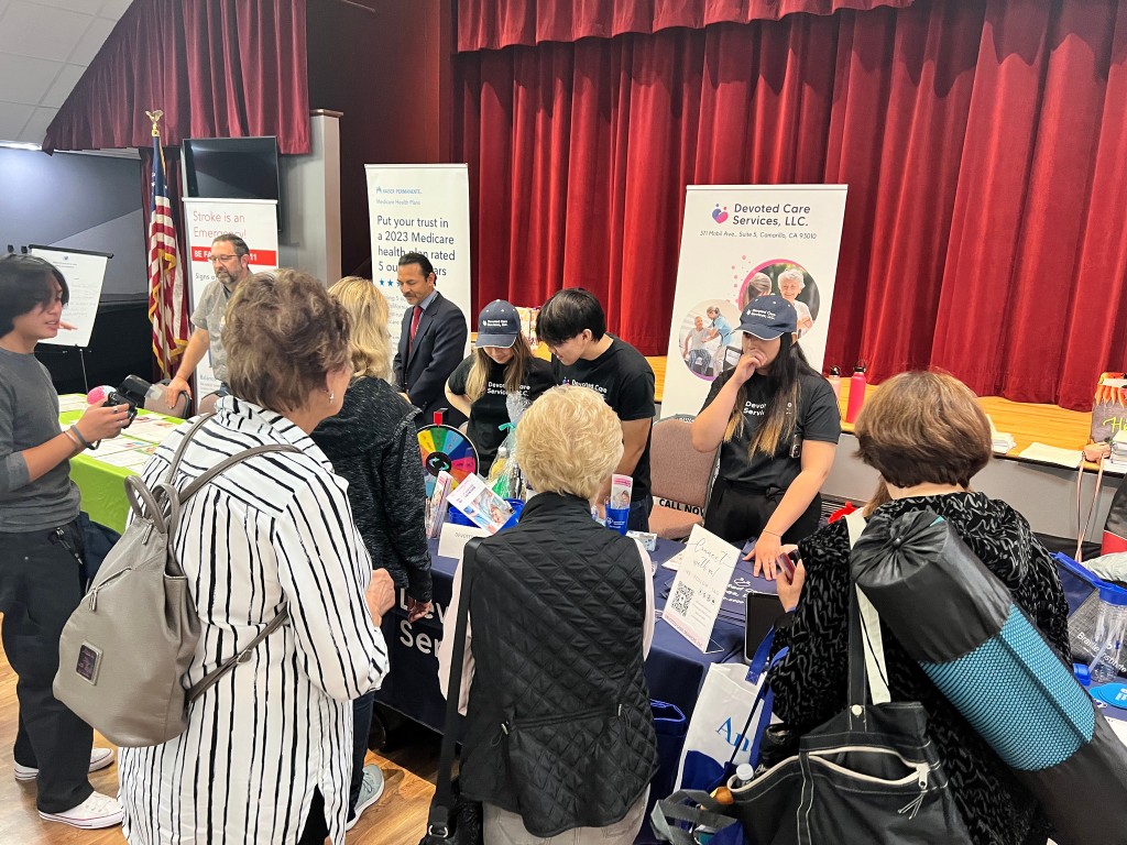 Residents and staff interacting at a community event