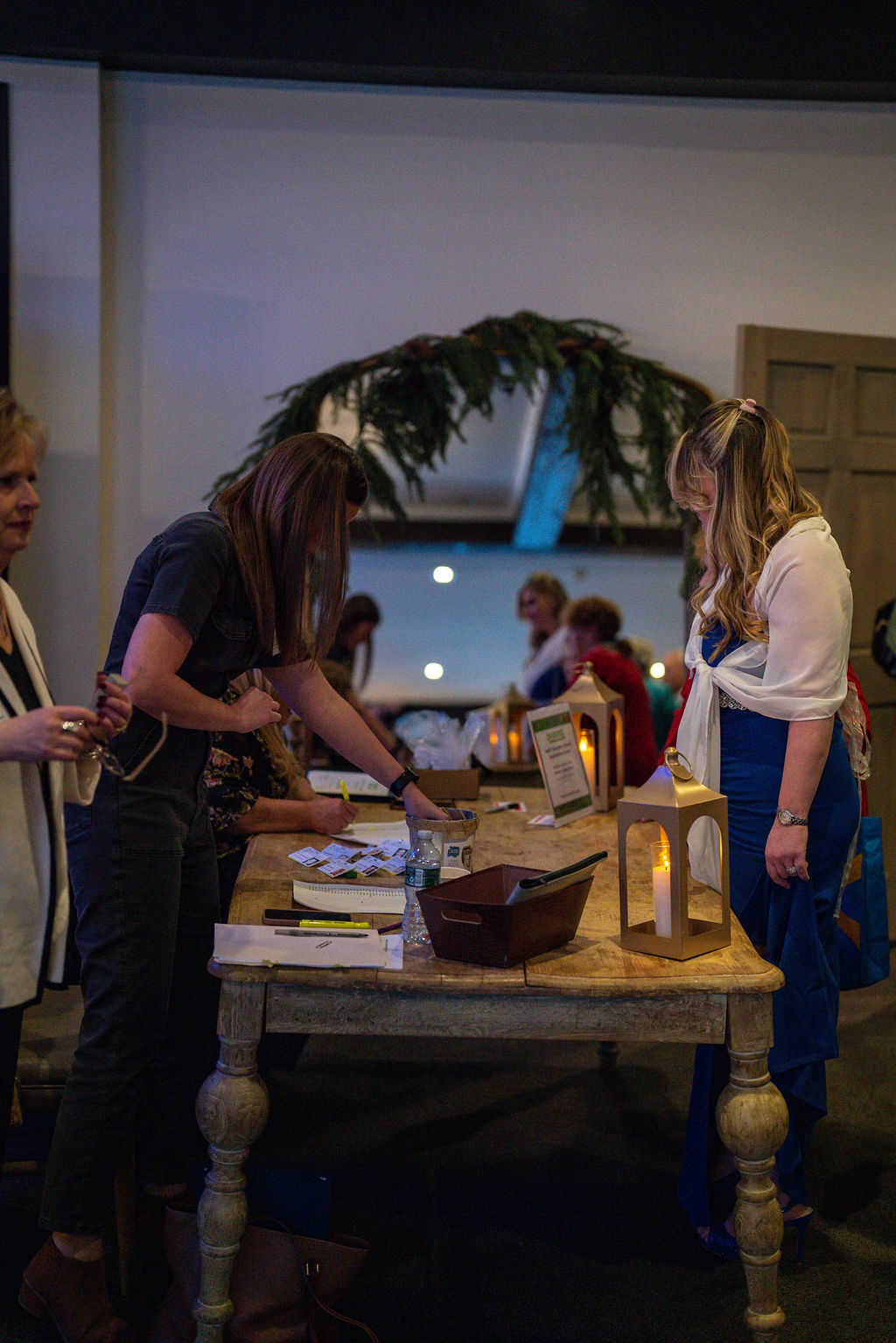 People at a registration table during an event