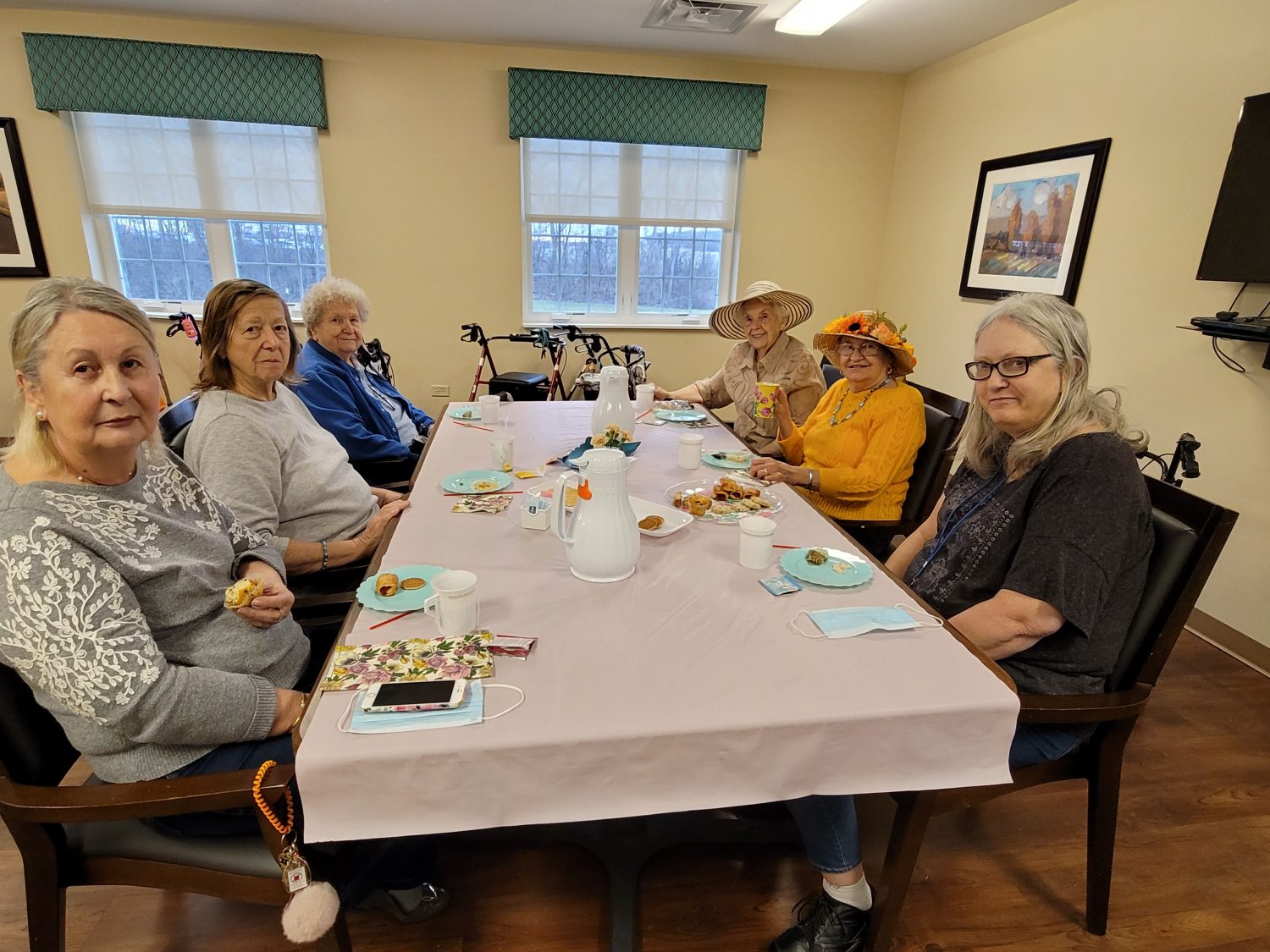 Residents enjoying a meal together in a communal dining area