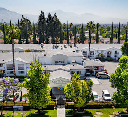 Aerial view of Parkside Senior Apartments surrounded by greenery
