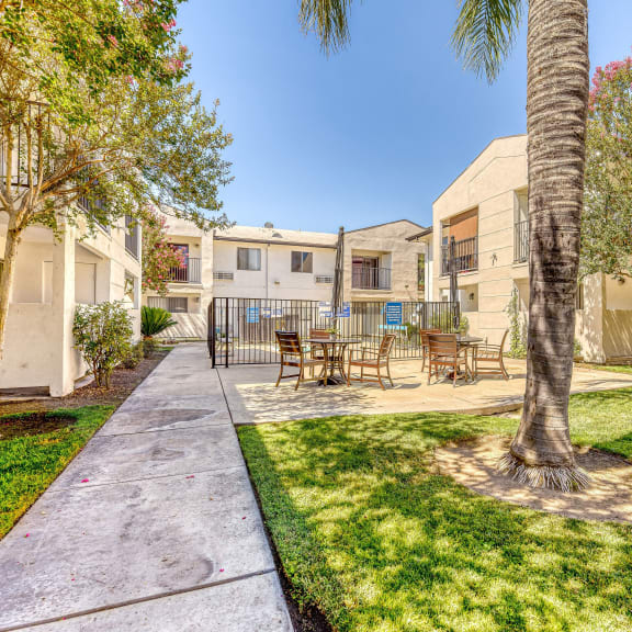 Outdoor space with seating and well-maintained landscaping