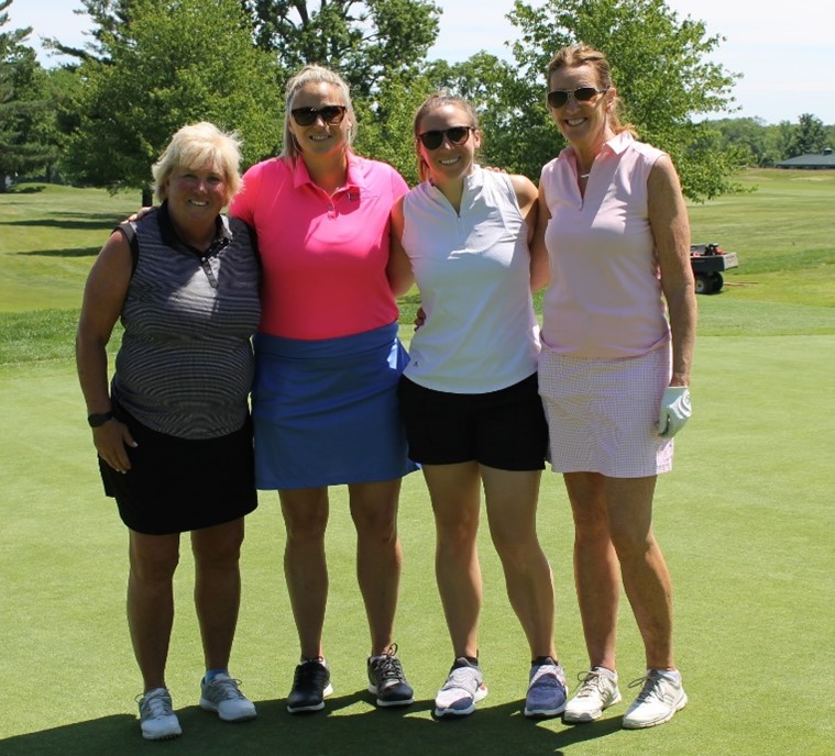Four women enjoying a day on the golf course.