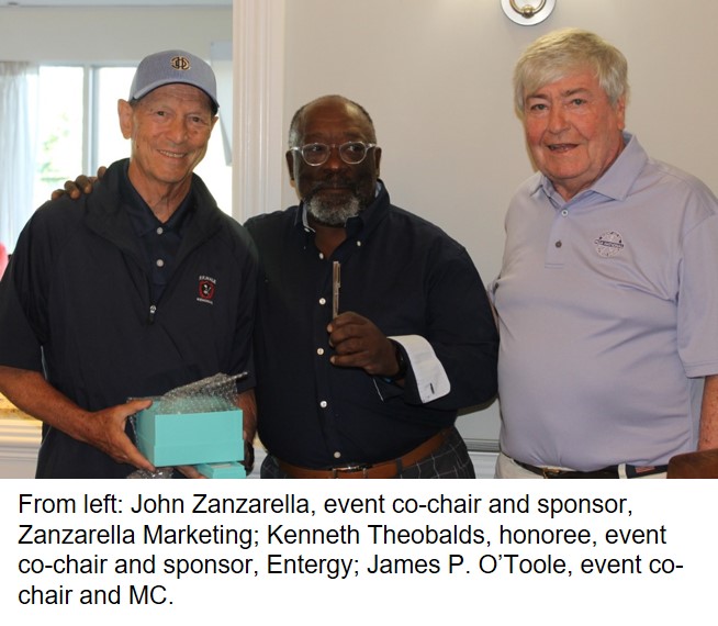 Three men at an event in a social setting.