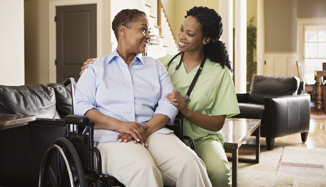 Resident and caregiver interacting in a common area