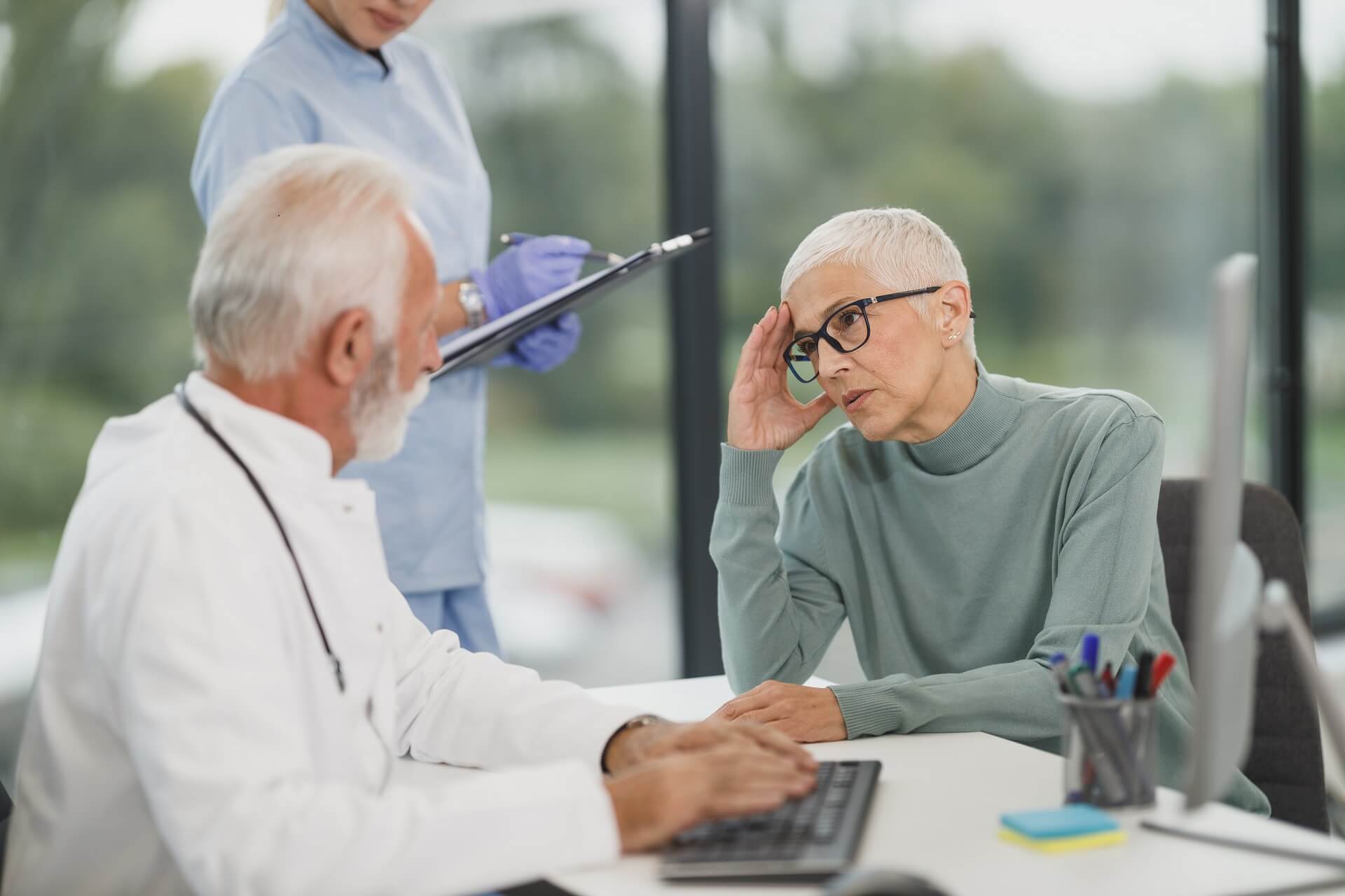 Doctor consulting with an elderly patient.