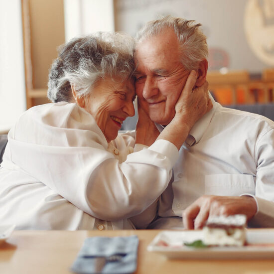 Couple sharing a joyful moment in a common area