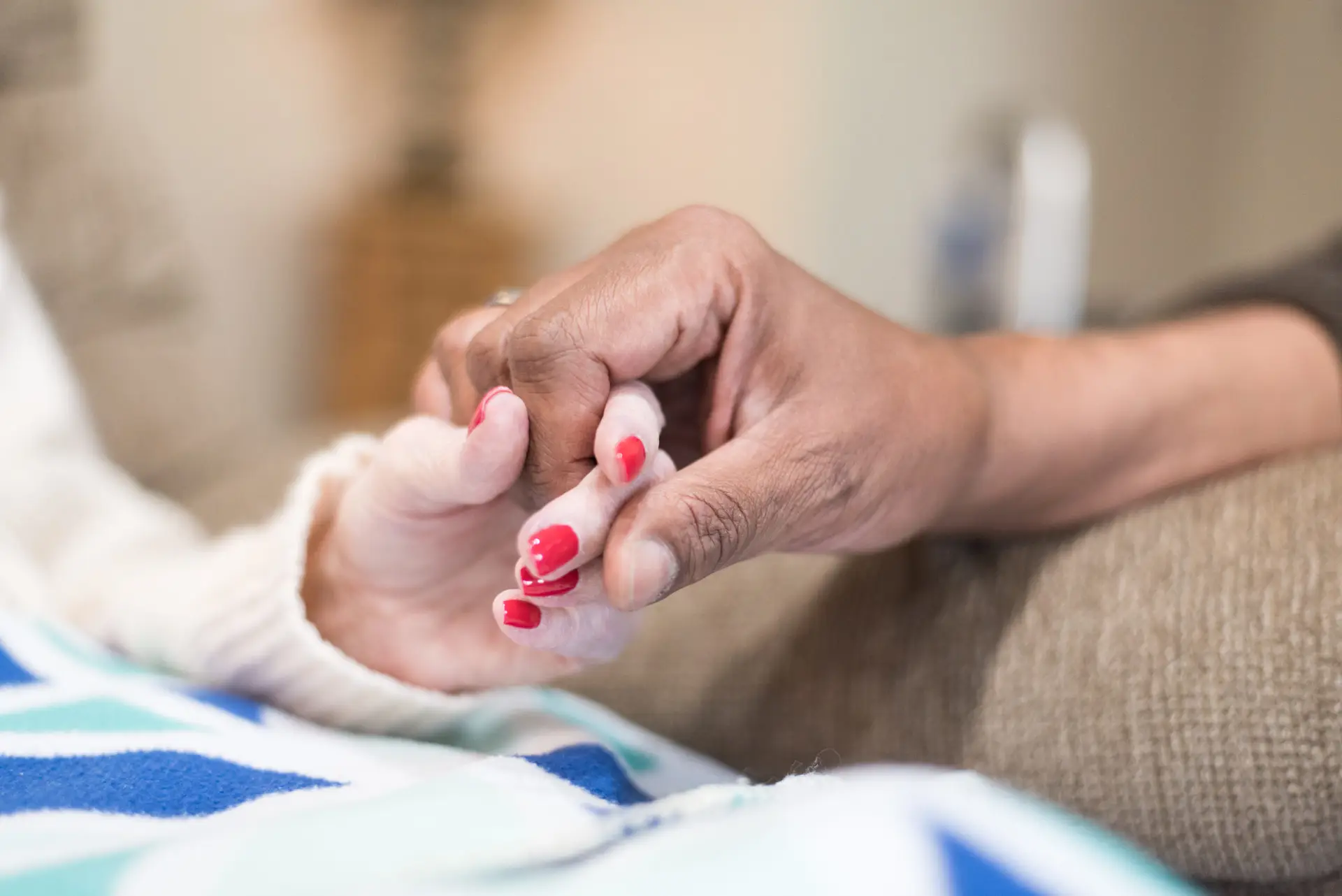 Close-up of hands showing connection and care.
