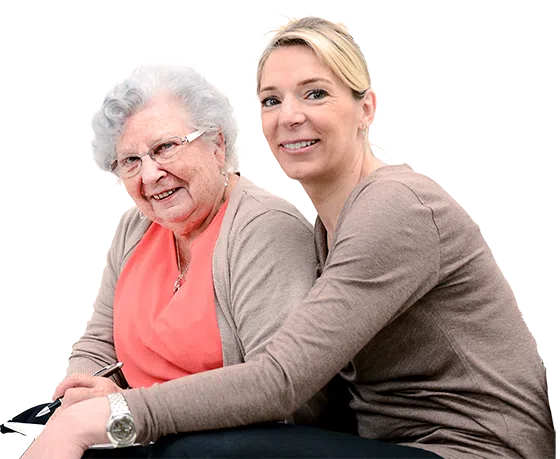 Senior woman and caregiver smiling together