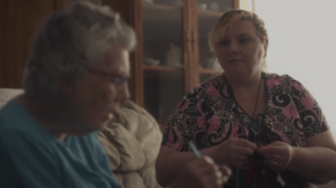 Caregiver interacting with a senior resident.