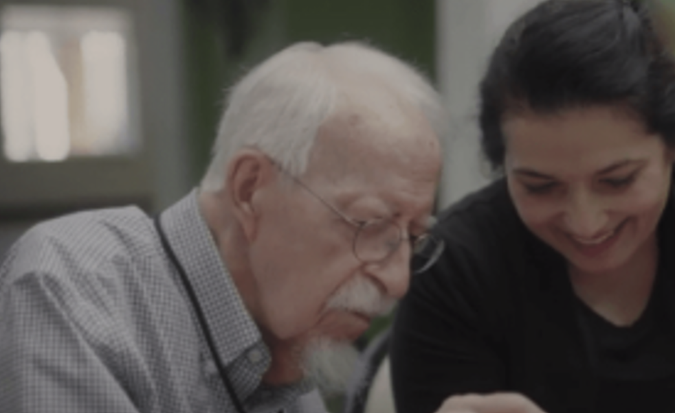 Resident and caregiver interacting together