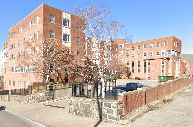 Exterior view of Woodstock Manor building.