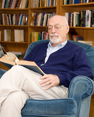 Senior man reading in a cozy chair