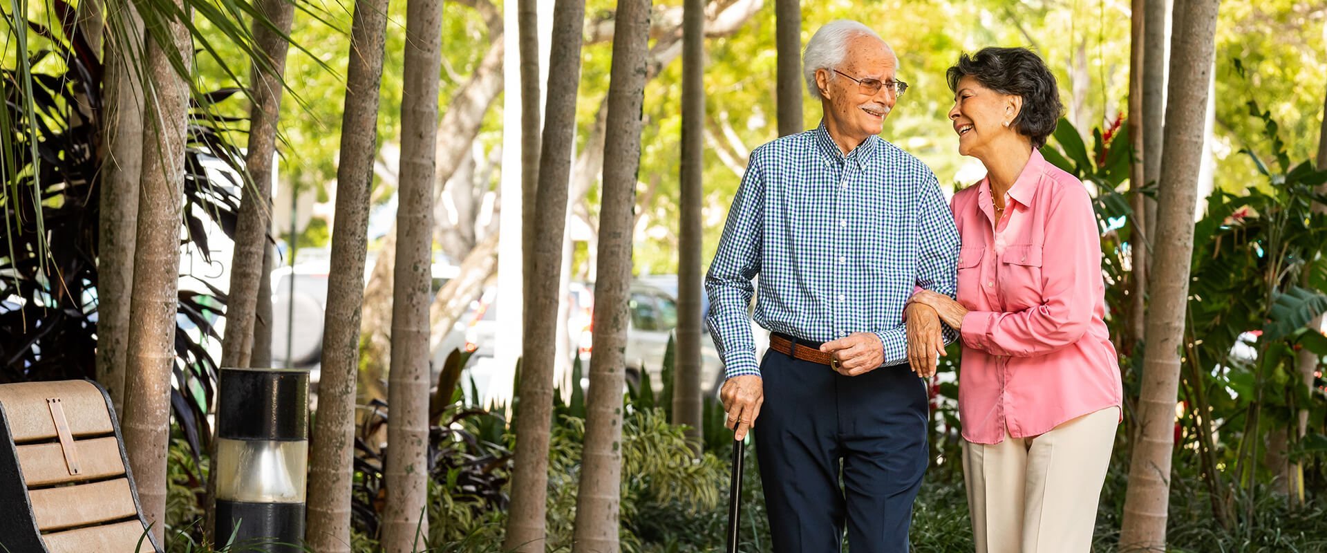 Residents enjoying a walk in a garden area